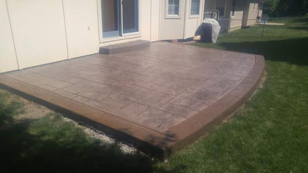 Finished stamped concrete patio with brown tones — Kansas City residential project