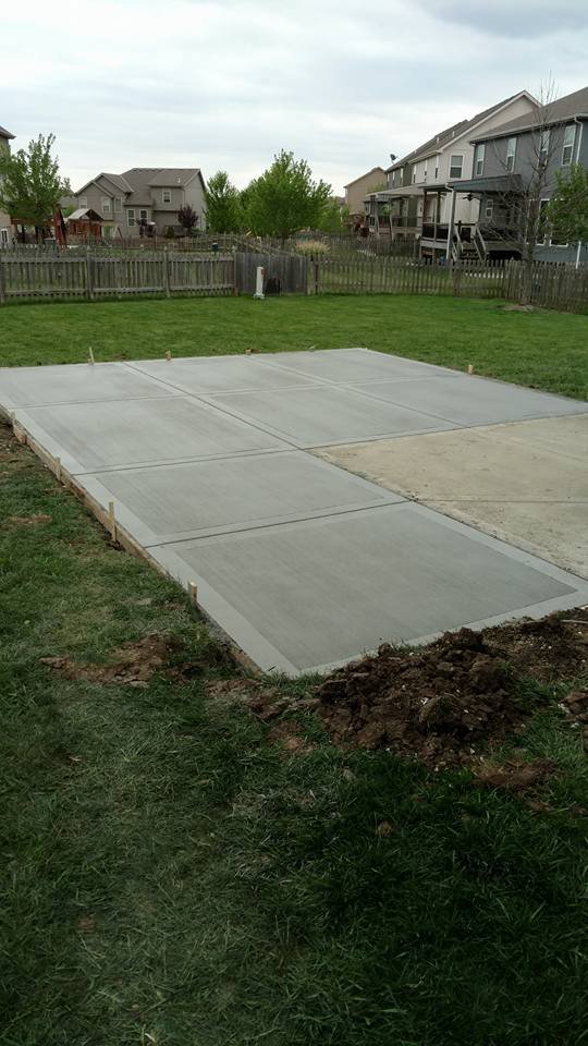 Finished concrete patio slab in a Kansas City residential backyard